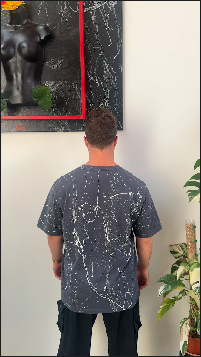 Custom hand-painted Carhartt K87 tee, back view with paint splatter
